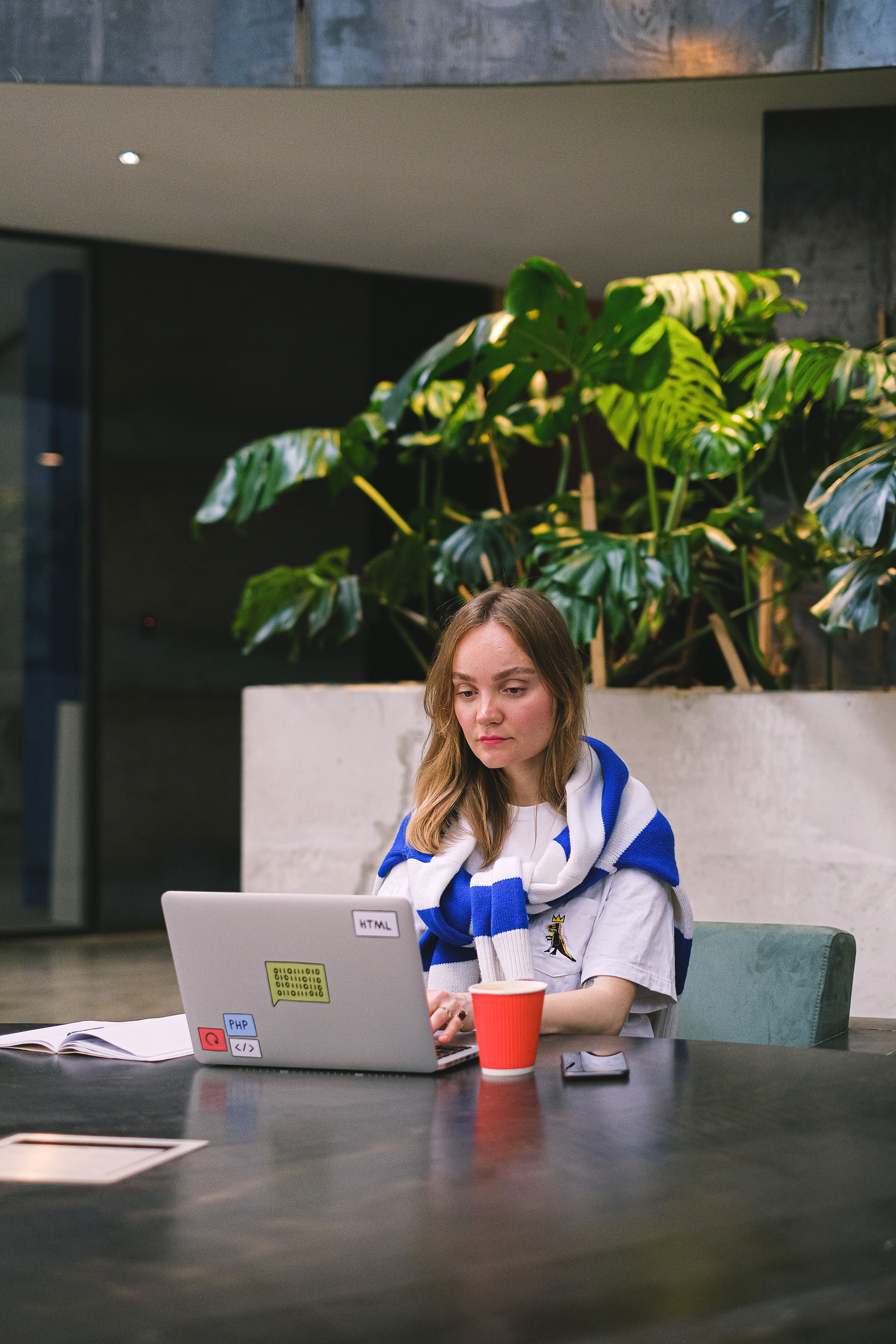 Freelance consultant working on a laptop in a modern European office