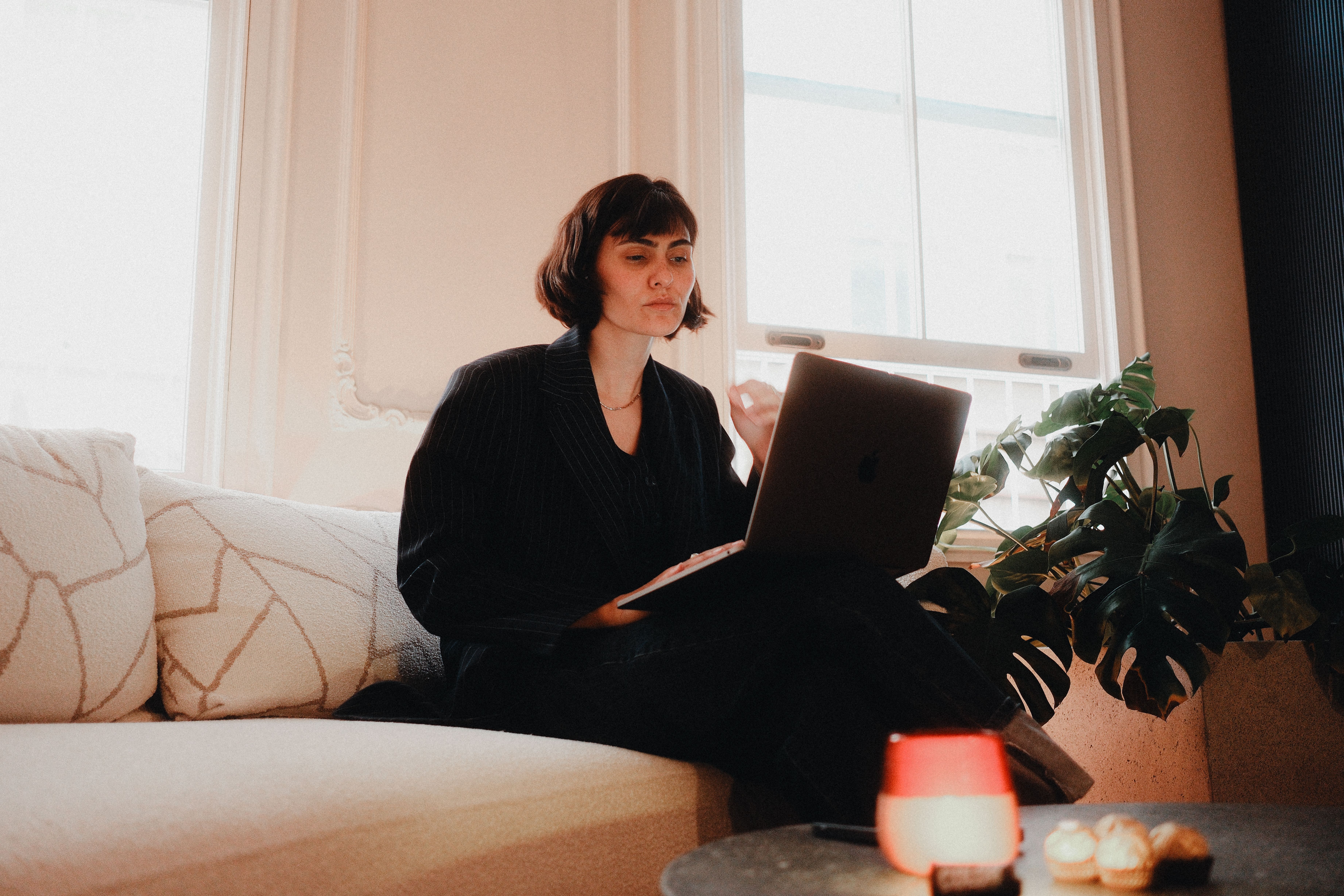 Professional working remotely from home on a laptop