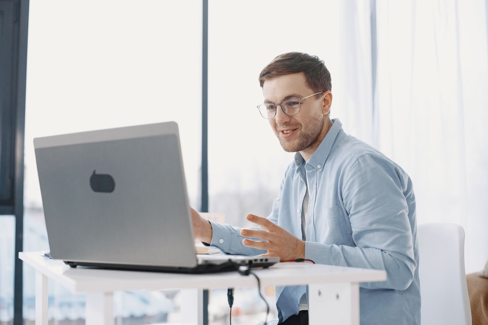 UK freelancer working on a laptop, free from quarterly Making Tax Digital admin